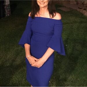 Chelsea28 royal blue crepe dress with cold shoulders and flared sleeves.